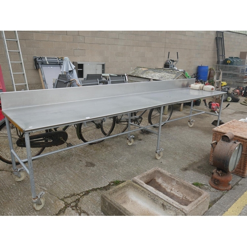 77 - STAINLESS STEEL TROLLEY TABLE - APPROX 12' LONG