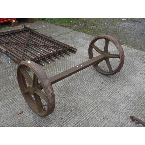 32 - CAST IRON AXLE & WHEELS