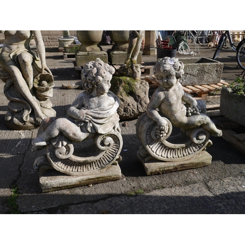 102 - PAIR OF ARCHITECTURAL GARDEN FIGURES