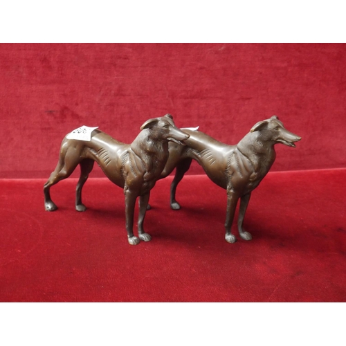 309 - PAIR OF BRONZE DOG ORNAMENTS