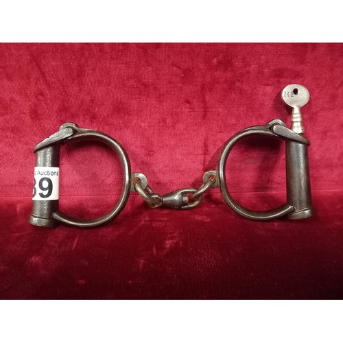39 - SET OF ANTIQUE HANDCUFFS