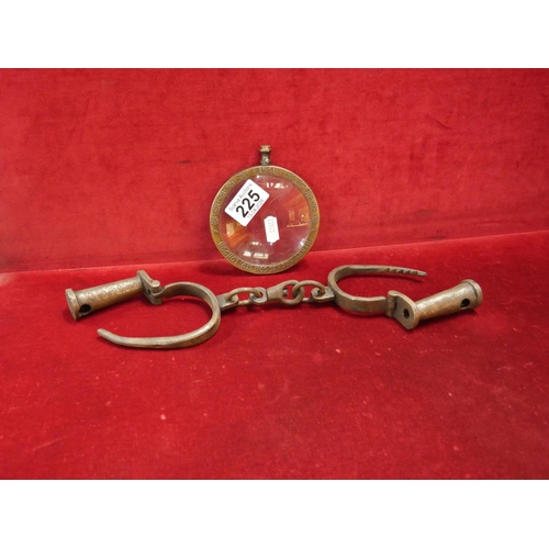 225 - OLD HANDCUFFS NO KEYS AND MAGNIFYING GLASS