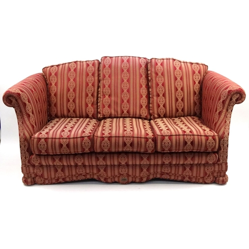 23A - Dellbrook three seater settee with red and gold striped upholstery, approximately 200cm long