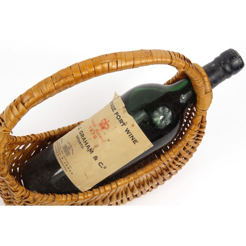 62 - Bottle of vintage port W. & J. Graham & Co, Oporto, Finest Reserve 1970, housed in a wicker carrying... 