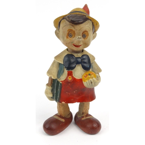 557 - Hand painted clockwork composite dancing Pinocchio toy, 20cm high