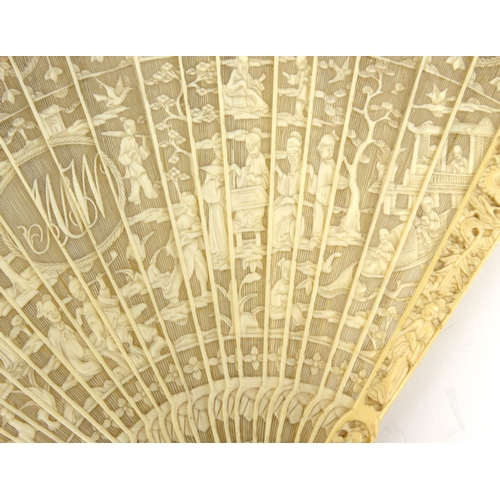 587 - Oriental Chinese pierced ivory fan pierced decorated with figures, dragons and landscape, 19cm long