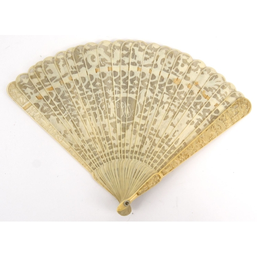 587 - Oriental Chinese pierced ivory fan pierced decorated with figures, dragons and landscape, 19cm long