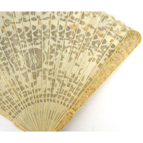 587 - Oriental Chinese pierced ivory fan pierced decorated with figures, dragons and landscape, 19cm long