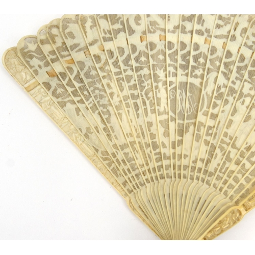 587 - Oriental Chinese pierced ivory fan pierced decorated with figures, dragons and landscape, 19cm long