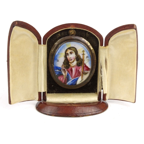 69 - Enamelled icon housed in a red leather case, the icon 5.5cm high including the mount