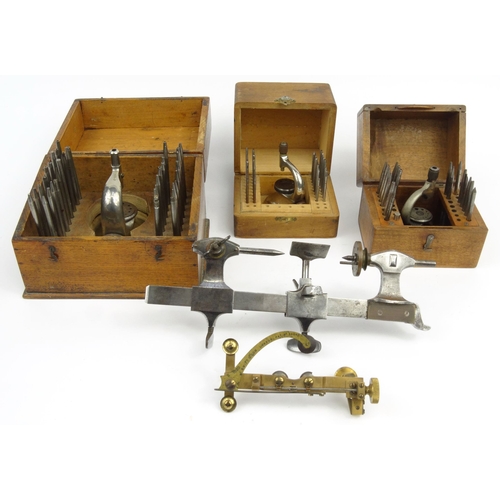 20 - Three wooden cased watchmaker's toolkits J. Swift & Son, London