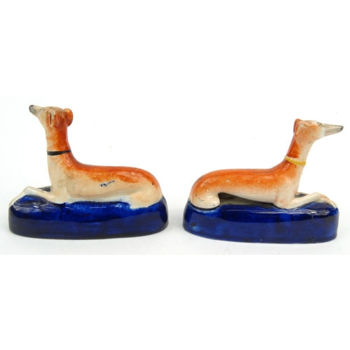 701 - Two Victorian hand painted Staffordshire greyhound pottery inkwells, 12cm diameter