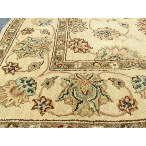 60 - Cream ground floral rug from Gooch Oriental Carpets, approximately 240cm x 165cm