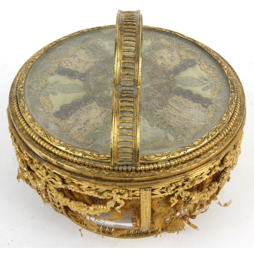 16 - French pierced gilt metal and glass powder bowl with bow and swag design inset with lace, 15cm tall