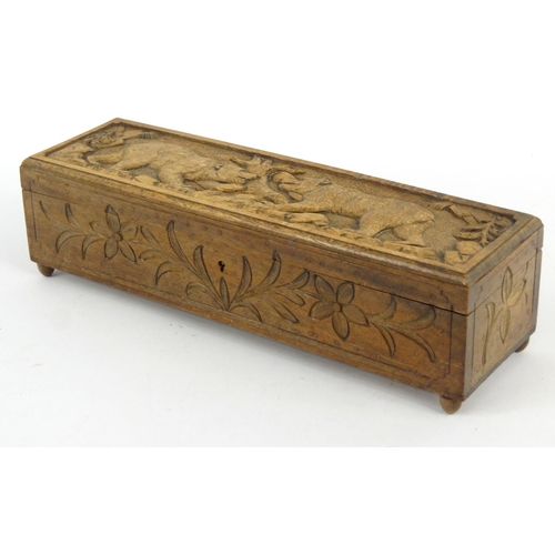 3 - Black Forest wooden glove box carved with bears and lined with a  green buttoned silk interior, 35cm... 