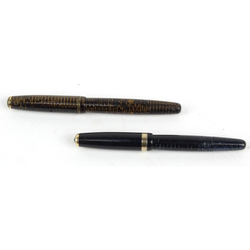 103 - Two Parker striped fountain pens ,two Parker striped ballpoint pens and an Eversharp example, the la... 