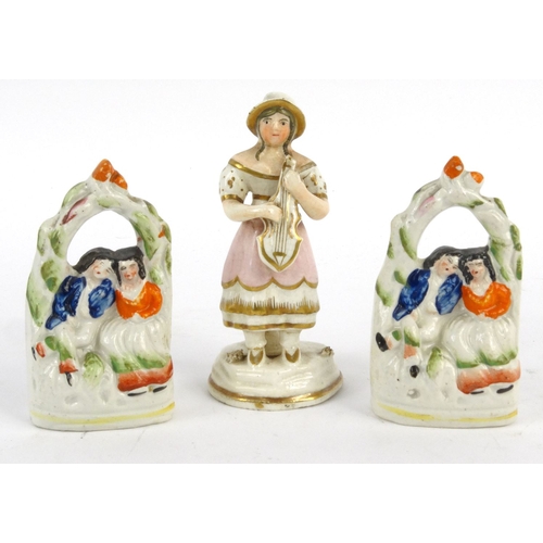 700 - Victorian hand painted Staffordshire miniature pottery fairings of lovers, together with a lady with... 