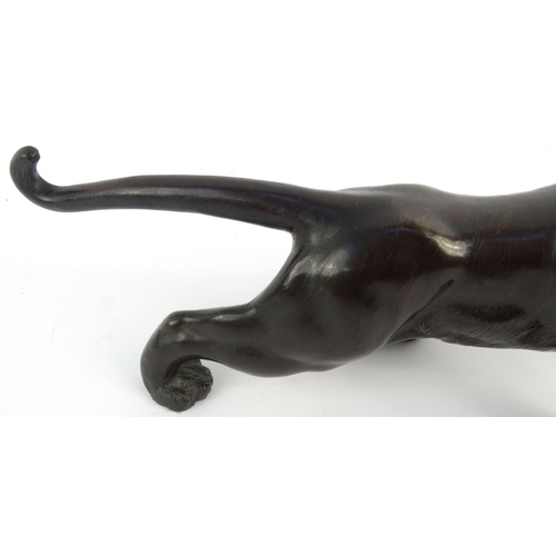 576 - Oriental Japanese bronze study of a tiger with beaded glass eyes, signature mark to belly, 46cm diam... 