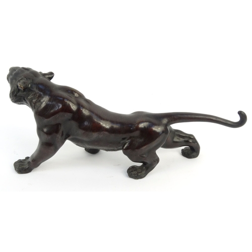 576 - Oriental Japanese bronze study of a tiger with beaded glass eyes, signature mark to belly, 46cm diam... 