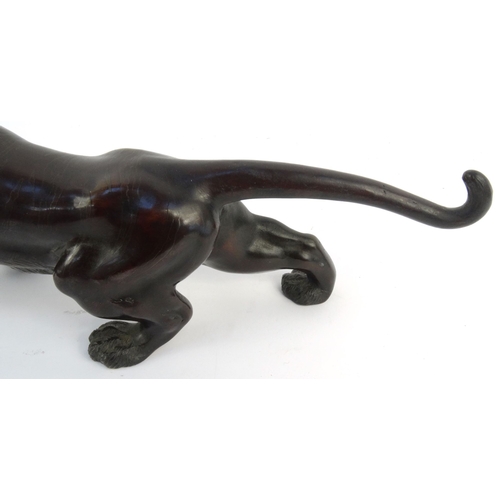 576 - Oriental Japanese bronze study of a tiger with beaded glass eyes, signature mark to belly, 46cm diam... 