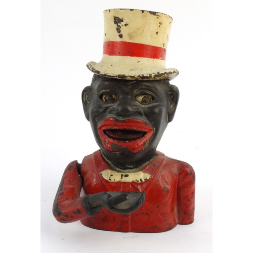 573 - Jolly nigger cast iron trick moneybox wearing a top hat, 22cm high