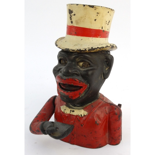 573 - Jolly nigger cast iron trick moneybox wearing a top hat, 22cm high