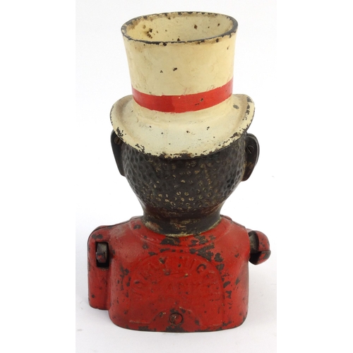 573 - Jolly nigger cast iron trick moneybox wearing a top hat, 22cm high