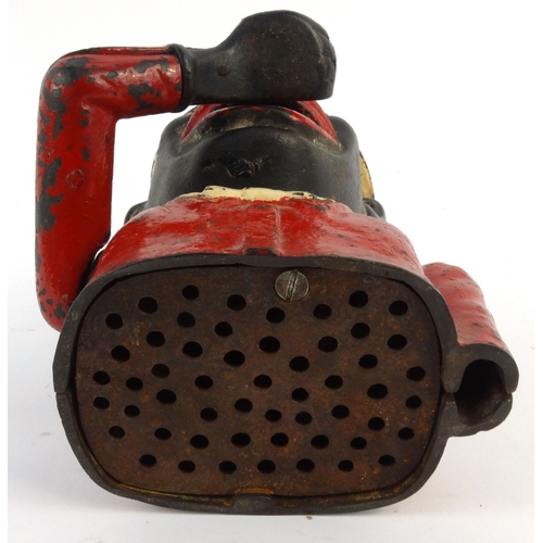 573 - Jolly nigger cast iron trick moneybox wearing a top hat, 22cm high