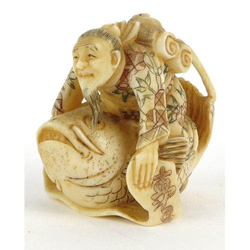 589 - Oriental Japanese ivory Netsuke in the form of an elderly man riding a carp, signature mark to base,... 