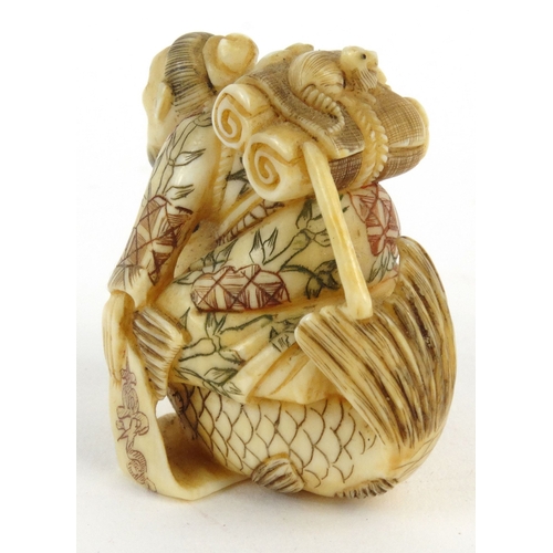 589 - Oriental Japanese ivory Netsuke in the form of an elderly man riding a carp, signature mark to base,... 