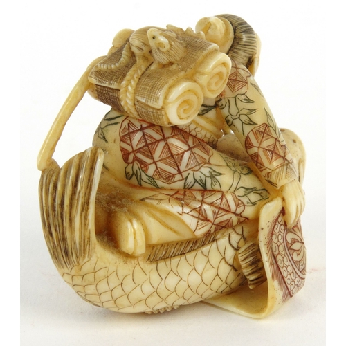 589 - Oriental Japanese ivory Netsuke in the form of an elderly man riding a carp, signature mark to base,... 