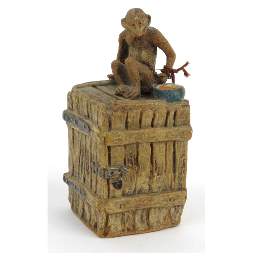 572 - Novelty interest monkey on a teachest moneybox, 13cm high