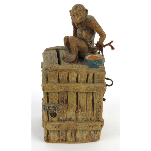 572 - Novelty interest monkey on a teachest moneybox, 13cm high