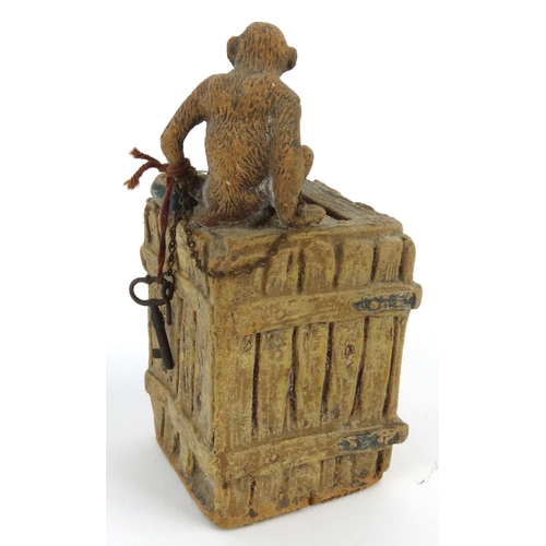 572 - Novelty interest monkey on a teachest moneybox, 13cm high