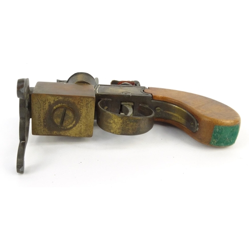 125 - Dunhill tinder pistol table lighter, registered number 794093, 14cm diameter