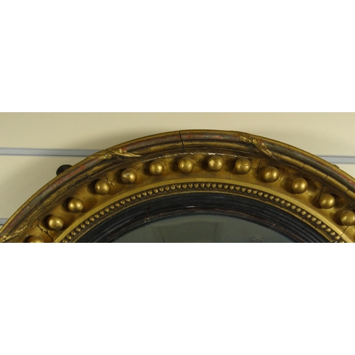 14 - Victorian circular convex gilt wood mirror, 64cm diameter