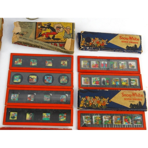 564 - Child's tinplate Magic Lantern with assorted Mickey Mouse, Snow White and the Seven Dwarves, Three L... 