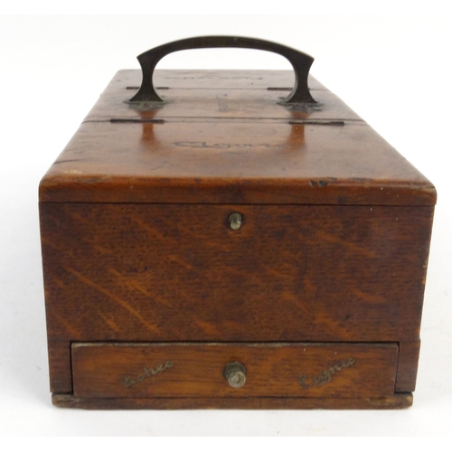 136 - Edwardian oak cigarette, tobacco and cigar box with brass handle, 28cm diameter