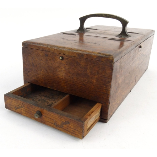 136 - Edwardian oak cigarette, tobacco and cigar box with brass handle, 28cm diameter
