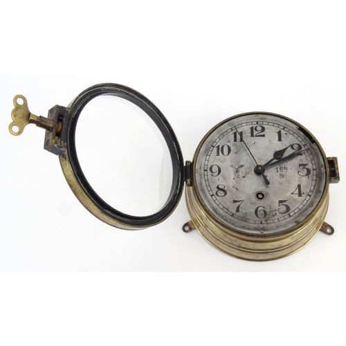 447 - Military interest brass World War II Kriegsmarine U-Boat clock numbered 185, 20cm diameter