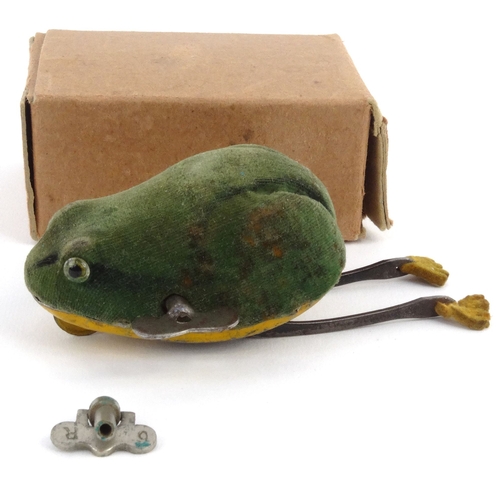 561 - Schuco tinplate clockwork leaping frog, housed in a cardboard box, 7.5cm high