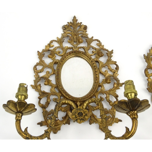 13 - Pair of Victorian gilt brass girondelle mirrors with floral scrolls  each 35cm high