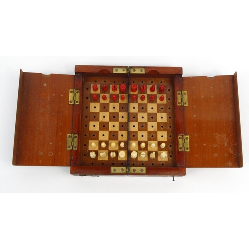 570 - Mahogany folding travelling boxed chess set, 18cm square