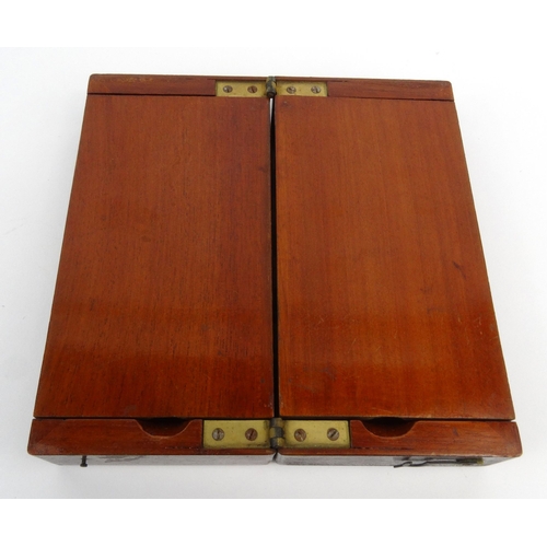 570 - Mahogany folding travelling boxed chess set, 18cm square