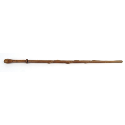 138 - Wooden walking stick naively carved with a serpent, 85cm long