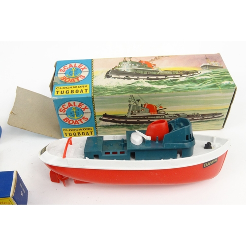 568 - Boxed Scalex clockwork tug boat and boxed Matchbox lorries and cars