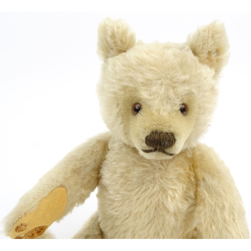 537 - Vintage Steiff straw filled teddy bear with jointed limbs and growler, stud to the ear, 33cm high