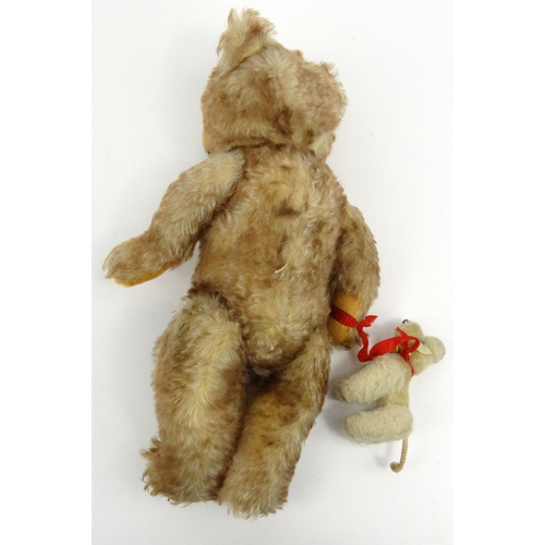 534 - Vintage Hermann straw filled teddy bear with jointed limbs and original poodle attached, 40cm high