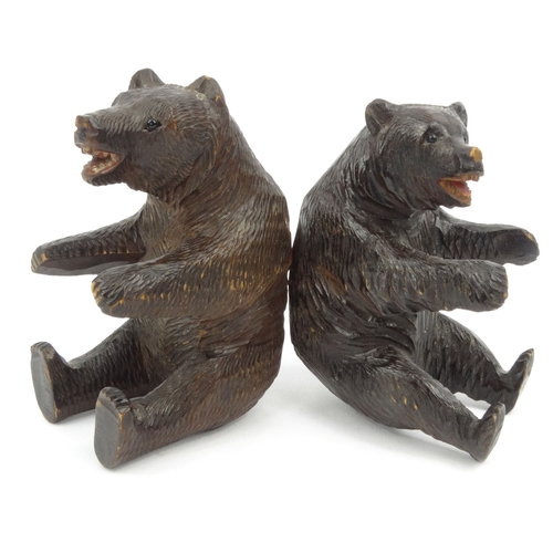 5 - Two carved wooden Black Forest bears, the larger 10cm high