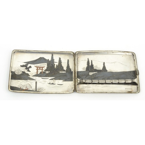 584 - Oriental Japanese sterling silver cigarette case decorated with landscape scenes, 11cm diameter